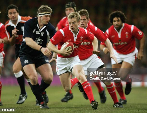 Dwayne Peel of Wales goes past Scotland's Gavin Kerr during the RBS Six Nations Championship match between Wales and Scotland at the Millennium...