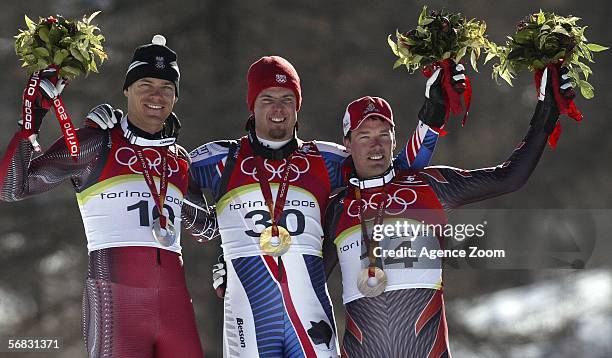 Winners Michael Walchhofer of Austria, silver, Antoine Deneriaz of France, gold and Bruno Kernen of Switzerland, bronze pose together after the Mens...