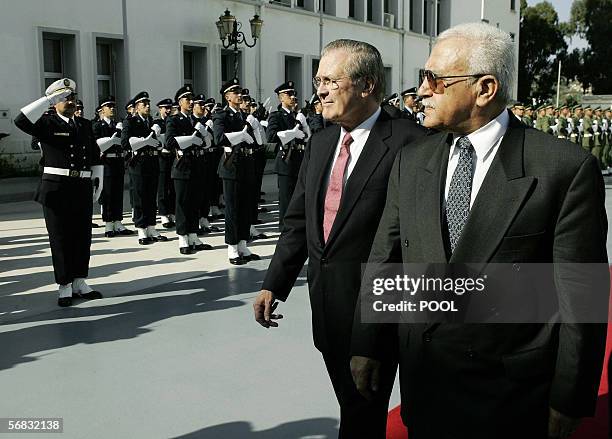 Secretary of Defense Donald H. Rumsfeld and his Algerian counterpart Abdelmalek Guenaizia take part in a military ceremony at the Defense Ministry in...