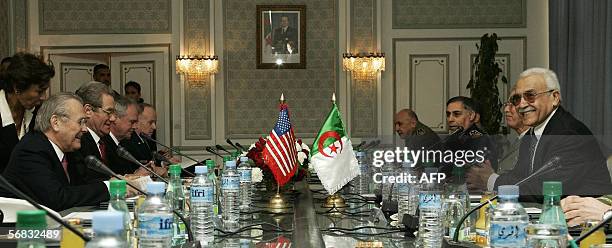 Secretary of Defense Donald Rumsfeld sits across the table from his Algerian counterpart Abdelmalek Guenaizia as they meet at the Defense Ministry in...