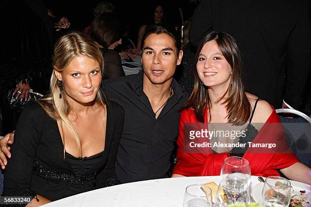 Charisse Verhaert, Juli Iglesias Jr and Chabeli Iglesias sit at the Julio Iglesias benefit concert at the Sheraton Bal Harbour on February 11, 2006...