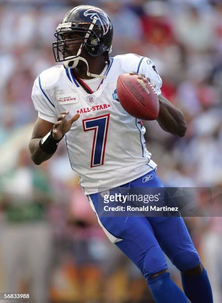 Quarterback Michael Vick of the NFC team drops back to pass against the AFC team during the NFL Pro Bowl on February 12, 2006 at Aloha Stadium in...