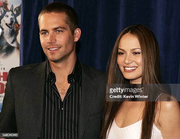 Actors Paul Walker and Moon Bloodgood pose at the premiere of Disney's "Eight Below" at the El Capitan Theater on February 12, 2006 in Los Angeles,...