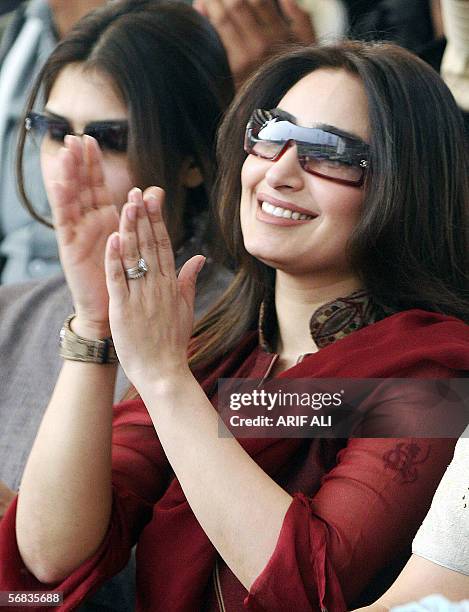 Popular Pakistani actress Reema claps as she watches the third One Day International match between Pakistan and India at The Gaddafi Cricket Stadium...