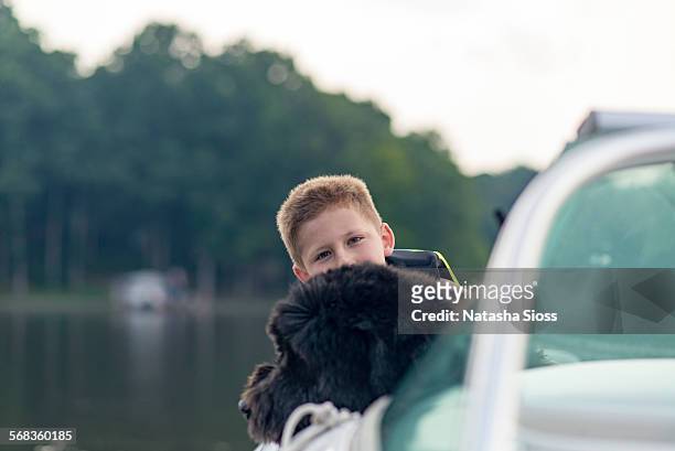 boating with the dog - bouvier des flandres ストックフォトと画像