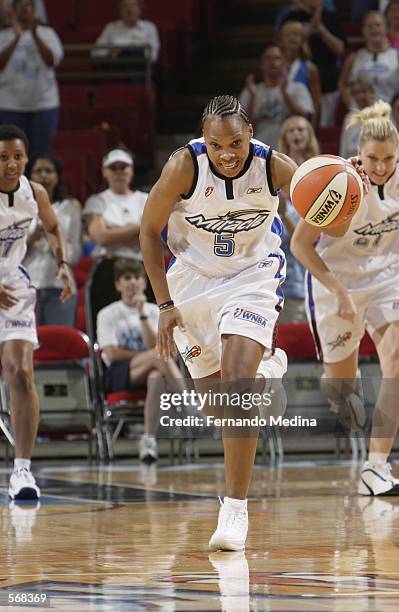 Elaine Powell of the Orlando Miracle drives upcourt during the preseason game against the Miami Sol at TD Waterhouse Centre in Orlando, Florida on...