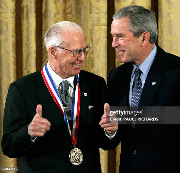 Washington, UNITED STATES: Dr. Norman E. Borlaug from Texas A&M University, College Station, Texas, signals thumbs-up as he receives the 2004...