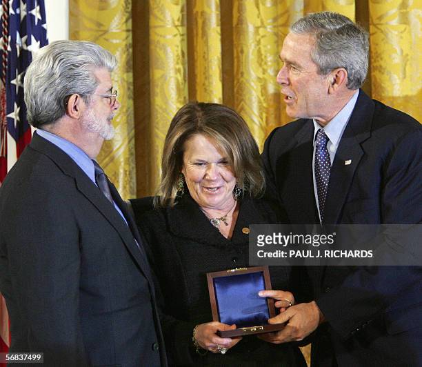 Washington, UNITED STATES: LucasFilm founder George Lucas and Industrial Light & Magic president Chrissie England accept their 2004 National Medal of...