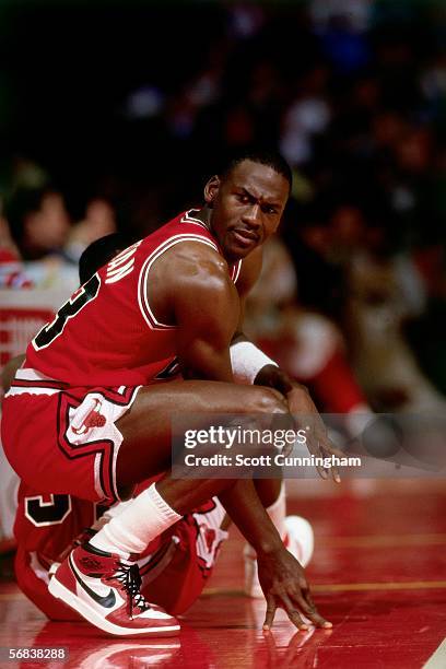 Michael Jordan of the Chicago Bulls waits to get back into the game against the Atlanta Hawks during an NBA game at the Omni circa 1987 in Atlanta,...