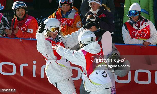 Hannah Teter of the United States celebrates winning the gold medal with teammate Gretchen Bleiler who won silver in the Womens Snowboard Half Pipe...