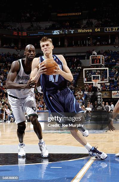 Andrei Kirilenko of the Utah Jazz drives to the basket past Kevin Garnett of the Minnesota Timberwolves during a game between the Utah Jazz and...