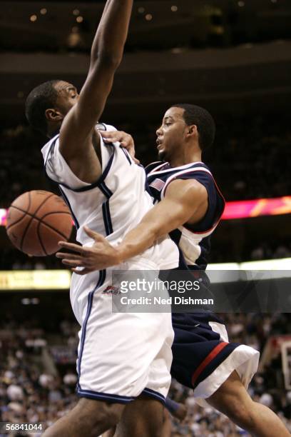 Marcus Williams of the University of Connecticut passes against Will Sheridan of Villanova University on February 13, 2006 at the Wachovia Center in...