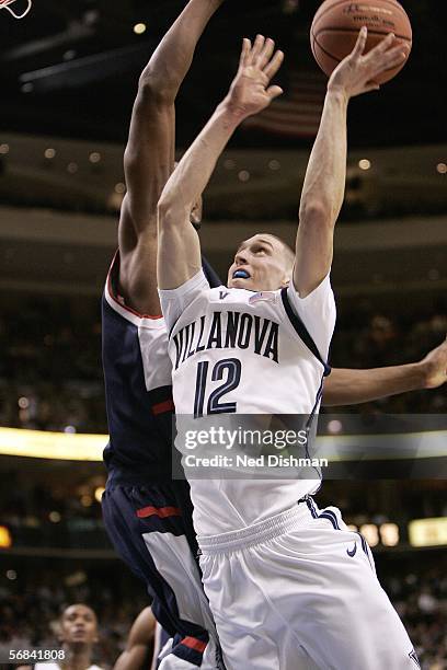 Mike Nardi of Villanova University shoots against Rudy Gay of the University of Connecticut on February 13, 2006 at the Wachovia Center in...