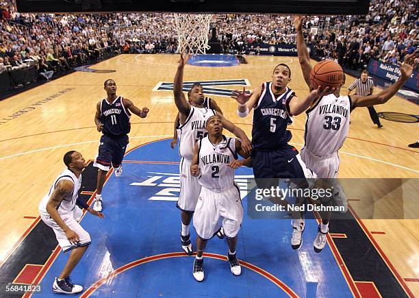 Marcus Williams of the University of Connecticut shoots against Randy Foye of Villanova University on February 13, 2006 at the Wachovia Center in...