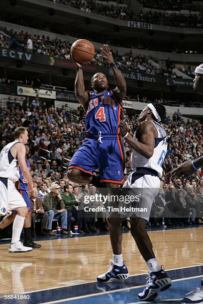 Nate Robinson of the New York Knicks takes a rebound against the Dallas Mavericks on February 13, 2006 at American Airlines Center in Dallas, Texas....