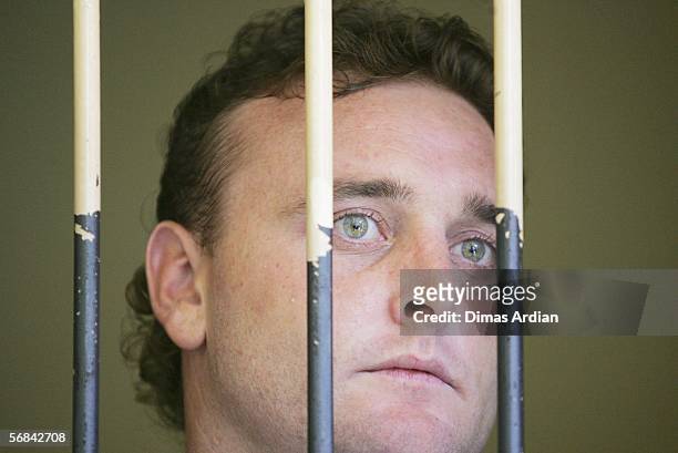 Martin Stephens stands inside a court holding cell February 14, 2006 in Denpasar, on the Indonesian resort island of Bali. Indonesian judges found...