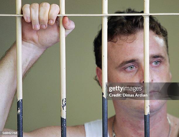 Martin Stephens stands inside a court holding cell February 14, 2006 in Denpasar, on the Indonesian resort island of Bali. Indonesian judges found...