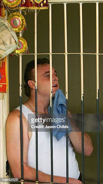 Martin Stephens attempts to cool down in his holding cell before his sentencing at Denpasar Court February 14, 2006 in Denpasar, on the Indonesian...