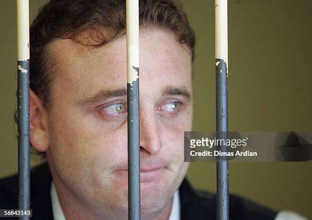 Martin Stephens stands inside a court holding cell February 14, 2006 in Denpasar, on the Indonesian resort island of Bali. Indonesian judges found...