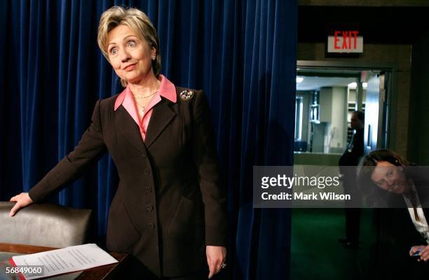 Sen. Hillary Clinton talks to a reporter before the start of a news conference with Sen. Mary Landrieu on Capitol Hill February 14, 2006 in...