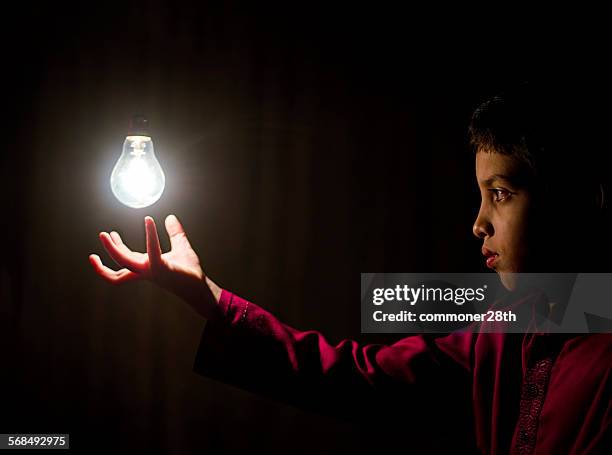 light up ! - magic trick child stock pictures, royalty-free photos & images