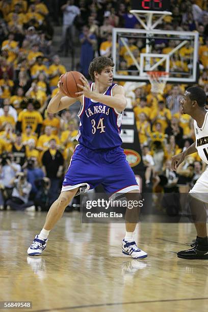 Christian Moody of the Kansas Jayhawks looks to pass the ball against the Missouri Tigers on January 16,2006 at Mizzou Arena in Columbia, Missouri....