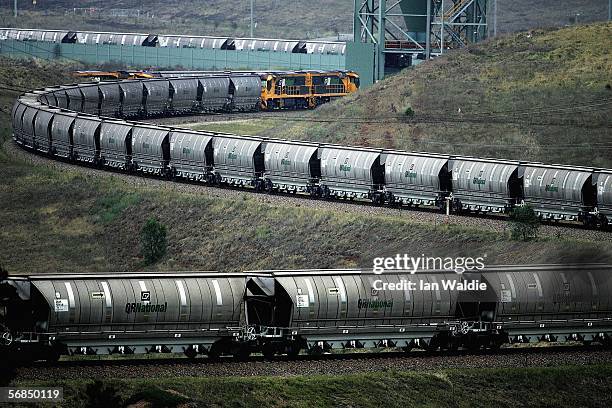 Coal train awaits loading at BHP Billiton's Mt Arthur coal mine February 15, 2006 in Muswellbrook, Australia. BHP today posted the biggest interim...