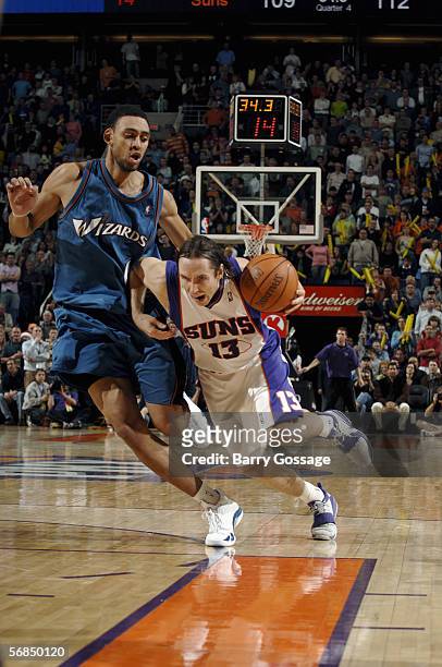 Steve Nash of the Phoenix Suns moves the ball against Jared Jeffries of the Washington Wizards during the NBA game on December 23 at America West...