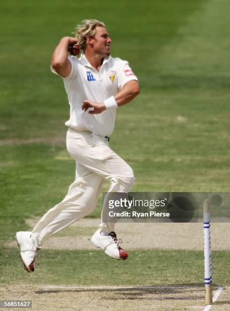 Shane Warne of the Bushrangers bowls during day three of the Pura Cup match between the Victorian Bushrangers and the Tasmanian Tigers at the...
