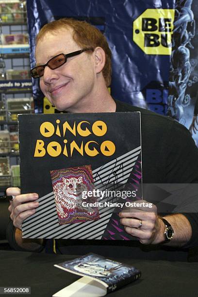 Danny Elfman poses with an old Oingo Boingo record at the in store signing of "Corpse Bride" on DVD, February 14, 2006 in Los Angeles California.