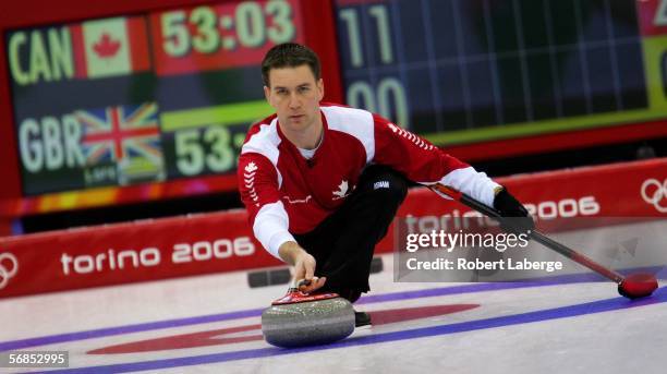 Brad Gushue of Canada competes in the preliminary round of the men's curling between Canada and Great Britain during Day 5 of the Turin 2006 Winter...