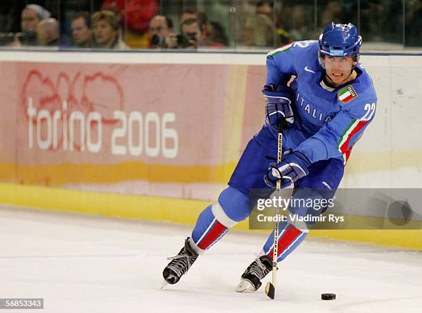 Stefano Margonni of Italy brings the puck down the ice during the men's ice hockey Preliminary Round Group A match against Canada on Day 5 of the...