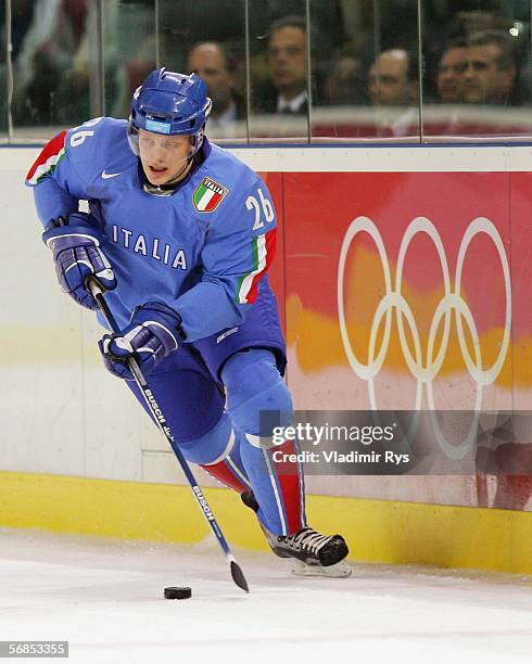 Armin Helfer of Italy brings the puck down the ice during the men's ice hockey Preliminary Round Group A match against Canada on Day 5 of the Turin...