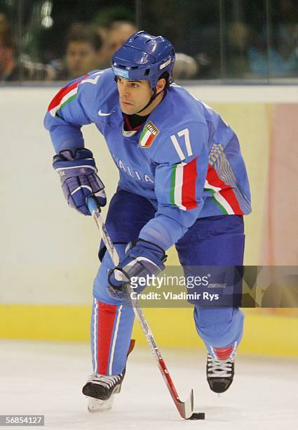Tony Iob of Italy brings the puck down the ice during the men's ice hockey Preliminary Round Group A match against Canada on Day 5 of the Turin 2006...