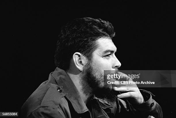 Headshot profile view of Argentinian-born Marxist revolutionary Ernesto Che Guevara , Cuban Minister of Industry, who is dressed in military fatigues...