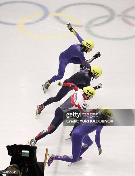 Ukraine's Volodymyr Grygoriev, USA's Apollo Ohno, Russia's Mikhail Rajine and The Netherland's Niels Kerstholt take the start in the men's 1000 m...