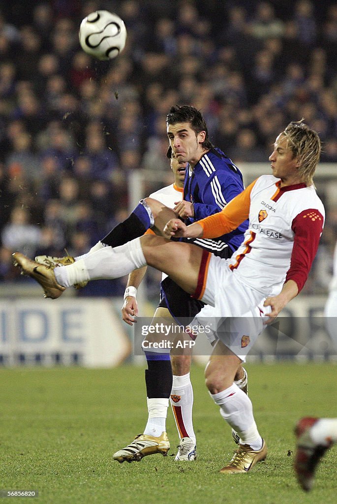 Club Brugge's Javier Portillo (L) and AS