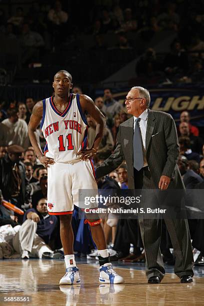 Jamal Crawford of the New York Knicks gets a pat on the back by head coach Larry Brown during a game against the Los Angeles Clippers at Madison...