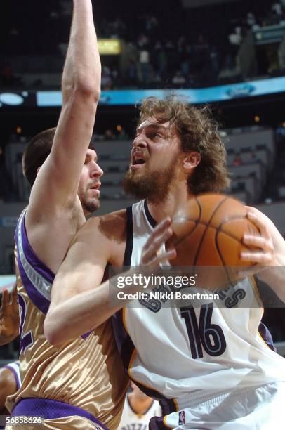 Pau Gasol of the Memphis Grizzlies drives against Brad Miller of the Sacramento Kings on February 15, 2006 at FedexForum in Memphis, Tennessee. NOTE...