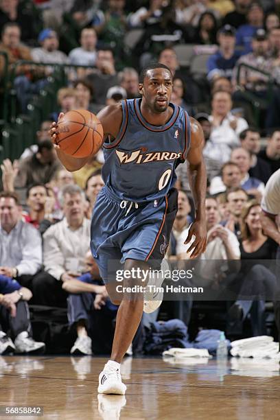 Gilbert Arenas of the Washington Wizards drives the ball down the court against the Dallas Mavericks on February 15, 2006 at American Airlines Center...