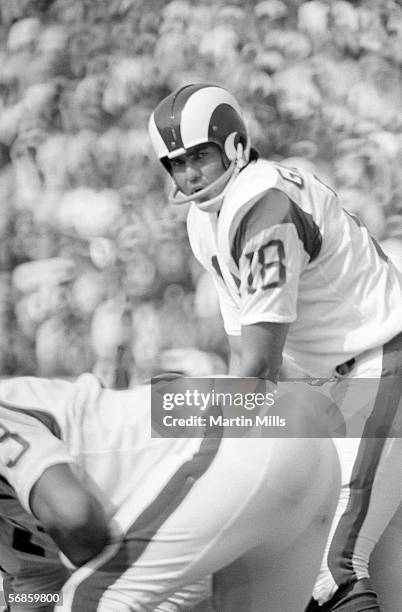 Quarterback Roman Gabriel of the Los Angeles Rams looks over his left as he calls a play at the line of scrimmage during a game circa 1960's. Roman...