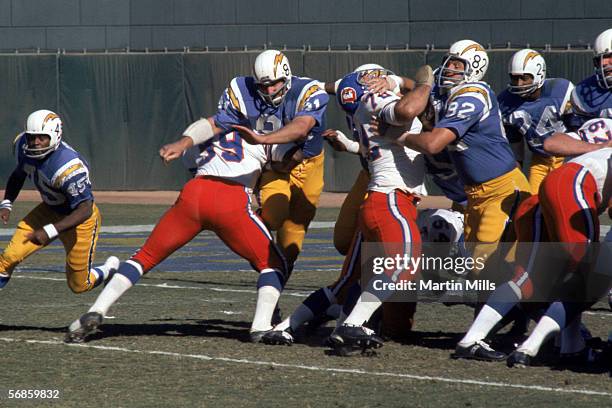 The San Diego Chargers battle against the Denver Broncos at the line of scrimmage during a game circa 1960's.