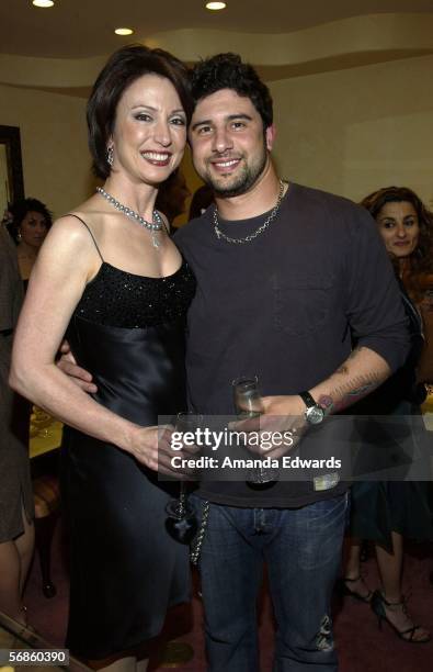 Jeweler Erica Courtney and her son Josh attend a Pre-Oscar viewing party at Courtney's showroom on February 15, 2006 in Los Angeles, California.