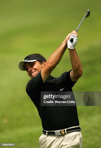 Francesco Molinari of Italy plays his second shot into the ninth green during the first round of the Maybank Malaysian Open 2006 at Kuala Lumpur Golf...