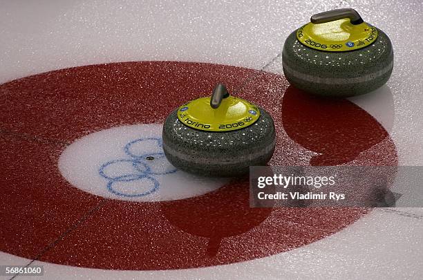 Curling stones are seen during the preliminary round of the women's curling between Canada and Switzerland during Day 6 of the Turin 2006 Winter...