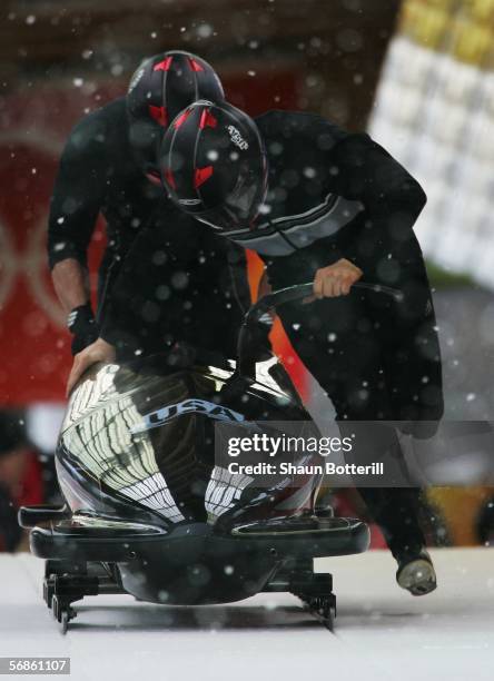 Driver Todd Hays of the United States competes with his partner in the Two Man Bobsleigh Training on Day 6 of the 2006 Turin Winter Olympic Games on...