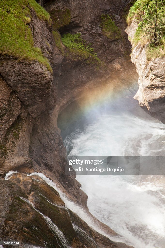 Rainbow over waterfall