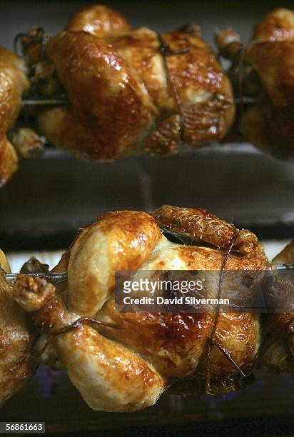Chickens are roasted on a rotisserie grill at a restaurant February 16, 2006 in Ra'anana in central Israel. Officials are trying to reassure...