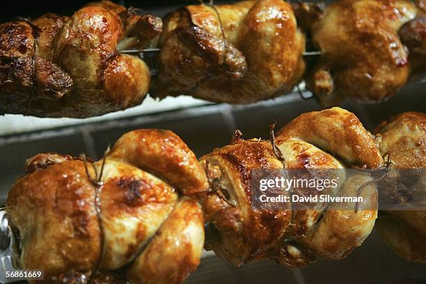 Chickens are roasted on a rotisserie grill at a restaurant February 16, 2006 in Ra'anana in central Israel. Officials are trying to reassure...