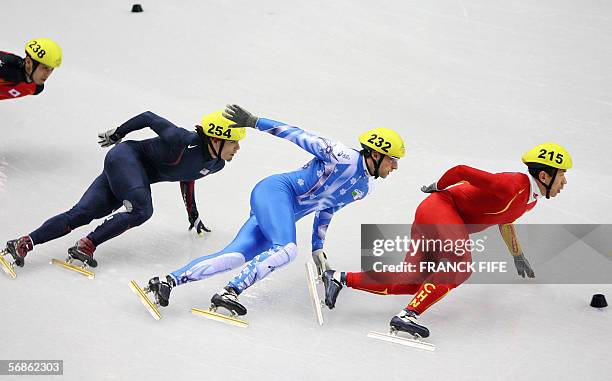 China's Li Jiajun leads in front of Italy's Nicola Rodigari, USA's Apollo Anton Ohno and Japan's Satoru Terao in the men's 5000 m relay semifinal...